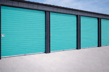 Overhead Doors | Garage Door - Storage Doors | Commercial roll up door in a teal color